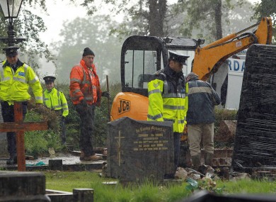 The remains of a body, thought to have been that of Columba McVeigh, are removed from a graveyard in Scotstown in June. The remains have been shown not to belong to McVeigh.