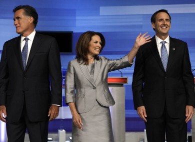 Michelle Bachmann (centre) and Tim Pawlenty (right) have both been keen to catch up on the Republican frontrunner, Mitt Romney (left).
