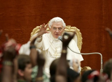 Pope Benedict XVI waves to the crowd gathered at his summer residence in the outskirts of Rome today.
