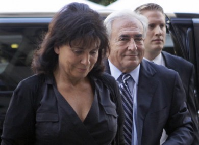 Dominique Strauss-Kahn, centre, arrives at court today with his wife Anne Sinclair.