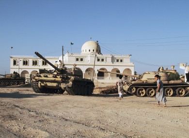 Rebels in Tarhuna, south-east of Tripoli, display tanks they claim to have taken from pro-Gaddafi troops.