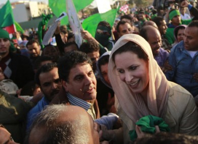File photo of Gaddafi's daughter Aisha, right, who reportedly arrived in Algeria today.