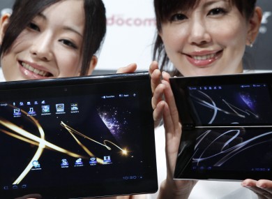 Models show off Sony's new tablet computers, Tablet S, left, and Tablet P during a launch event in Tokyo yesterday.