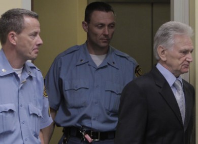 Momcilo Perisic enters the courtroom in The Hague to hear the court's verdict.