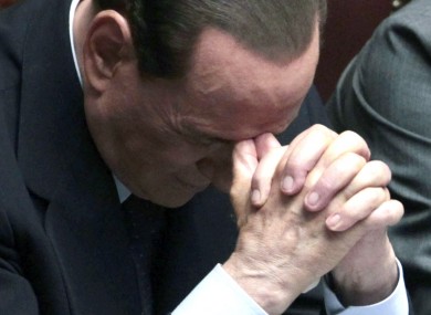 Berlusconi's government was cited as a reason for the downgrade