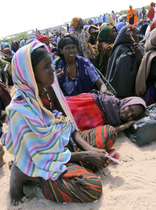 Somalian women wait for food to be handed out from the UNHCR in Mogadishu, to mark the end of Ramadan last week. A new UN report says famine conditions now exist in half of southern Somalia.