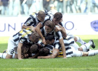 Juventus' players celebrate after Swiss defender Stephan Lichsteiner scores against Parma.