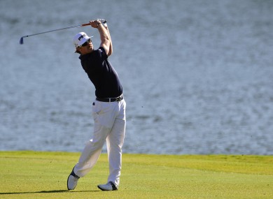 Hunter Mahan hits his approach shot on the 17th hole during the third round of the Tour Championship golf tournament at East Lake.