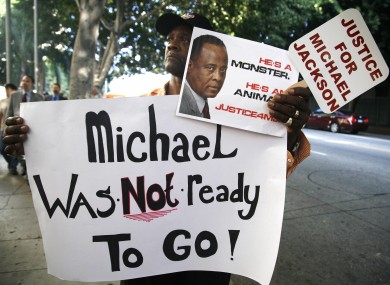 Michael Jackson fan Bristre Clayton, of Las Vegas, stands outside court during the trial of Conrad Murray.