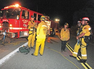 LA County firefighters on Lake Hughes Road in the Angeles National Forest last night.