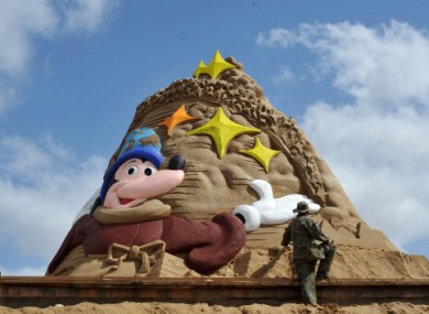 A sand sculptor works on a masterpiece ahead of the 13th Zhoushan International Sand Sculpture Festival, which opens on September 24. This year's theme?
