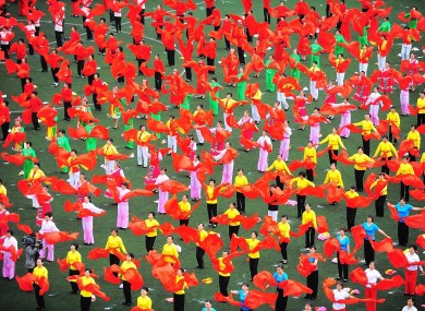 Residents of Yangzhou perform a 'fan dance' to celebrate China's national day