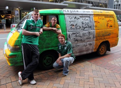 Ireland fans Daniel O'Connor, Daniel McLoughlin and Kebin O'Connor from Donegal with their van that has been signed by members of the Irish team outside the team hotel in Wellington.