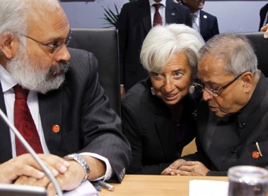 IMF head Christine Lagarde talks to India's Finance Minister Pranab Mukherjee, right, next to Reserve Bank of India deputy Governor Subir Gokarn during the G20 finance meeting in Paris on Saturday.