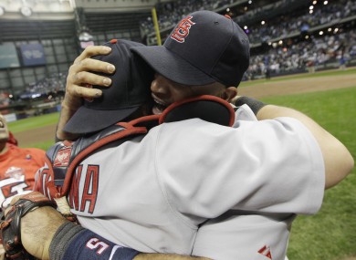 St. Louis Cardinals' Albert Pujols, right, hugs Yadier Molina after they beat the Milwaukee Brewers to win the National League championship series.