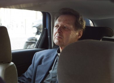 Roy Bourgeois sits in police car in a police car after being detained in Rome following his demonstration in favour of female ordination.