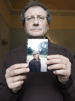 Holding an image of Sophie Tuscan Du Plantier is her uncle Jean-Pierre Gazeau
