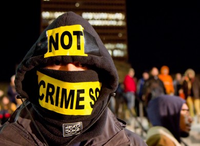 A Wall Street protester who declined to be identified participates in a rally in Nashville