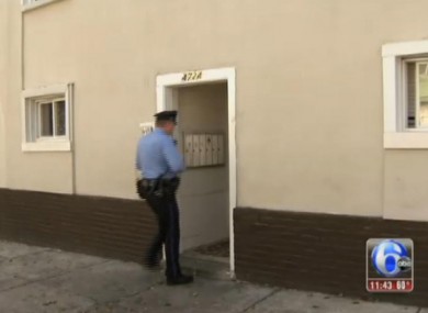 A police officer enters the building where the four were discovered.