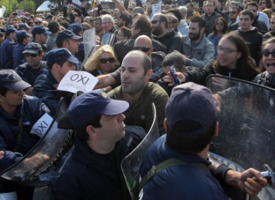 Anti-austerity protesters clash with riot police in Iraklio, Crete, on Friday.