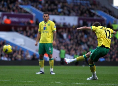 Anthony Pilkington curls home a free-kick for Norwich.
