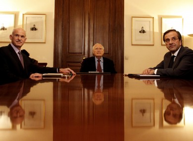 Papandreou, left, president Papoulias, centre, and opposition leader Samaras sit at the Presidential Palace in Athens on Sunday.