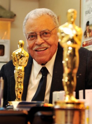 James Earl Jones the veteran American actor with his lifetime achievement Oscar, seen relected in a mirror in his dressing room at the Wyndham's Theatre where he is starring in Driving Miss Daisy, in central London.