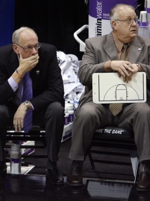 Bernie Fine, right, watches a game with Syracuse coach Jim Boeheim in 2010.
