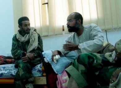 Video still of Seif al-Islam Gaddafi, left, after his capture.