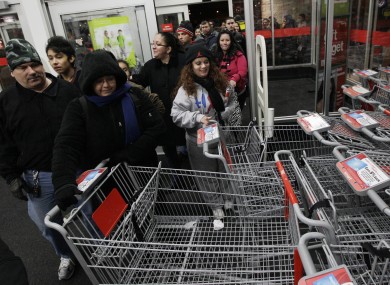 Shoppers rush into a K Mart in Chicago on Friday.