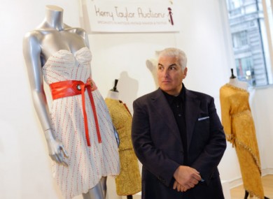 Mitch Winehouse stands by his late daughter's dress ahead of its auction today.