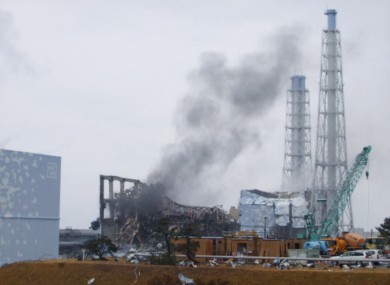 The smoking No. 3 reactor building (C) and buildings of reactors No. 2 (L, front) and No. 4 (R, back) of the quake-hit Fukushima Dai-ichi Nuclear Power Station