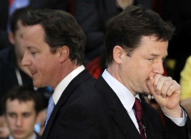 David Cameron (left) and Nick Clegg are deeply divided over the PM's veto at last week's Brussels talks.