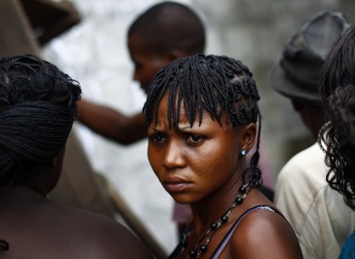 Congolese voters line up to vote after presidential ballots arrived in opposition candidate Etienne Tshisekedi's stronghold district of Masina in Kinshasa, Democratic Republic of Congo
