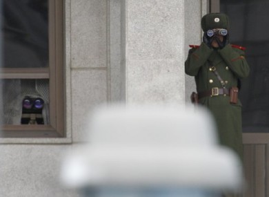 North Korean soldiers look at the southern side of the border on 2 November.