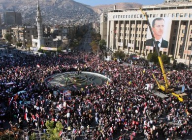 Crowds gather in Damascus for a rally in support of President Assad on 2 December.