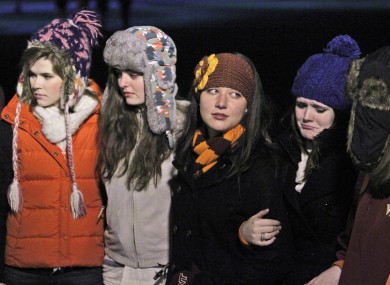Students participated in an impromptu candlelight vigil in front of the 4/16 memorial on the campus of Virginia Tech after two shootings on the campus.