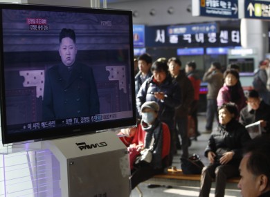 Travellers at Seoul train station watch footage of North Korea's next leader Kim Jong Un yesterday