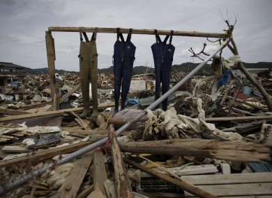 Fishermen's overalls hang in an area destroyed by the Japanese earthquake.