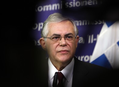 Lucas Papademos's government will have to leave the euro if it cannot finalise a deal on writing off some debts, a spokesman says.