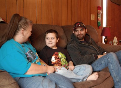 Kentucky mother Sandra Baker, left, sits with her son, Christopher, and husband, Scottie at Sandra's home in Harrodsburg, Kentucky