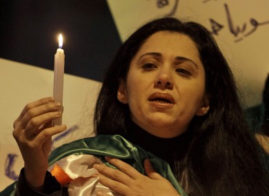 A Syrian woman at a candelight vigil in memory of those killed in the uprising, in Beirut, Lebanon.