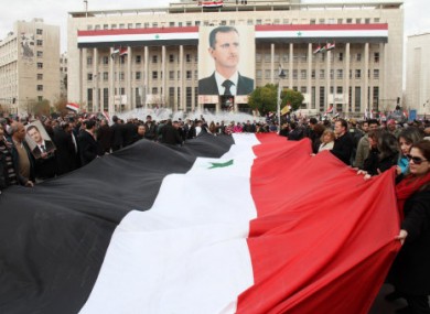 Syrian government supporters at a rally in Damascus, Syria yesterday.
