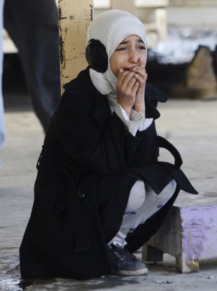 Waves of sectarian violence have recently left dozens dead in Iraq. Picture: Hana Abbas Lazim, 11, cries for her father who was killed in a bomb attack in Sadr City last Thursday, 5 Jan.