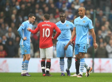 Vincent Kompany heads down the tunnel after he was sent off for dangerous play in yesterday's FA Cup third round match between Manchester City and Manchester United.