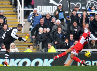 Leon Best sweeps a shot into the right corner of the QPR goal.