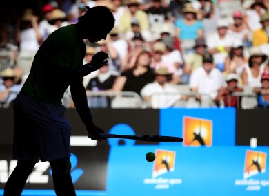 Rafael Nadal prepares to serve in the late afternoon light during his first round match against and Alex Kuznetsov.