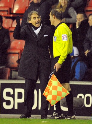 Mancini appealing to the assistant referee last night.
