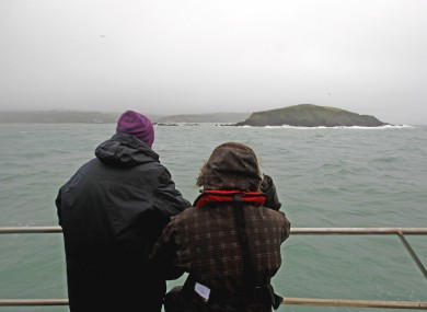Michael Hayes' wife Caitlín Ní Aodha and daughter Dervla look out to where the Tit Bonhomme lies off west Cork.