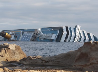 The cruise ship Costa Concordia leans on its side off the tiny Tuscan island of Giglio, Italy, Wednesday, Jan. 18, 2012.